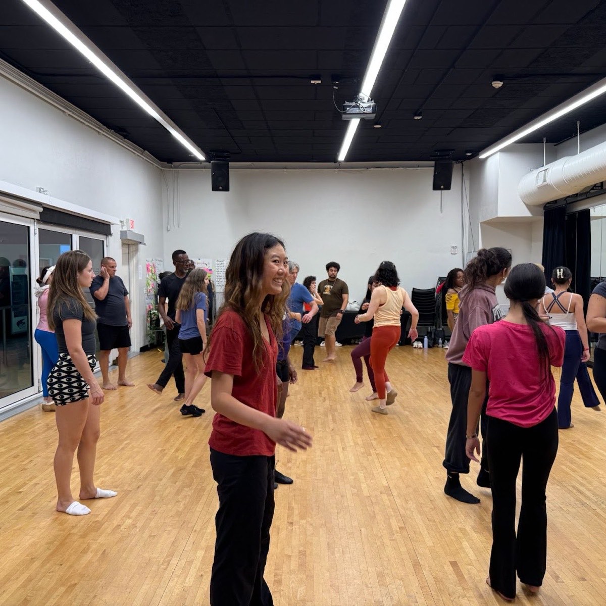 Dancers practicing Mozambique steps in the studio