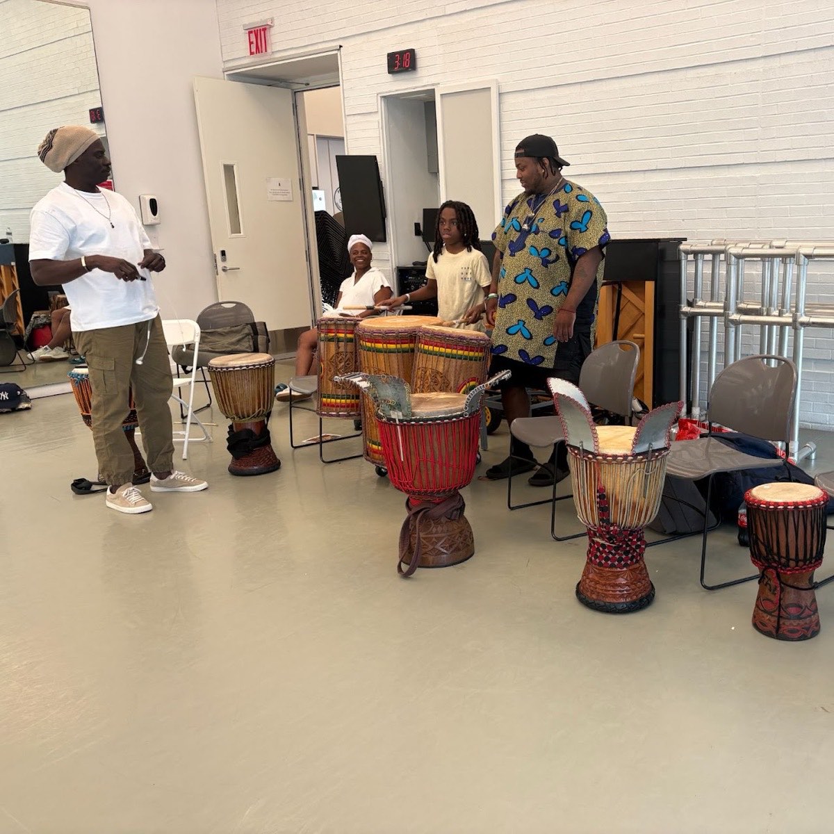 Dancers moving toward the drummers during the workshop
